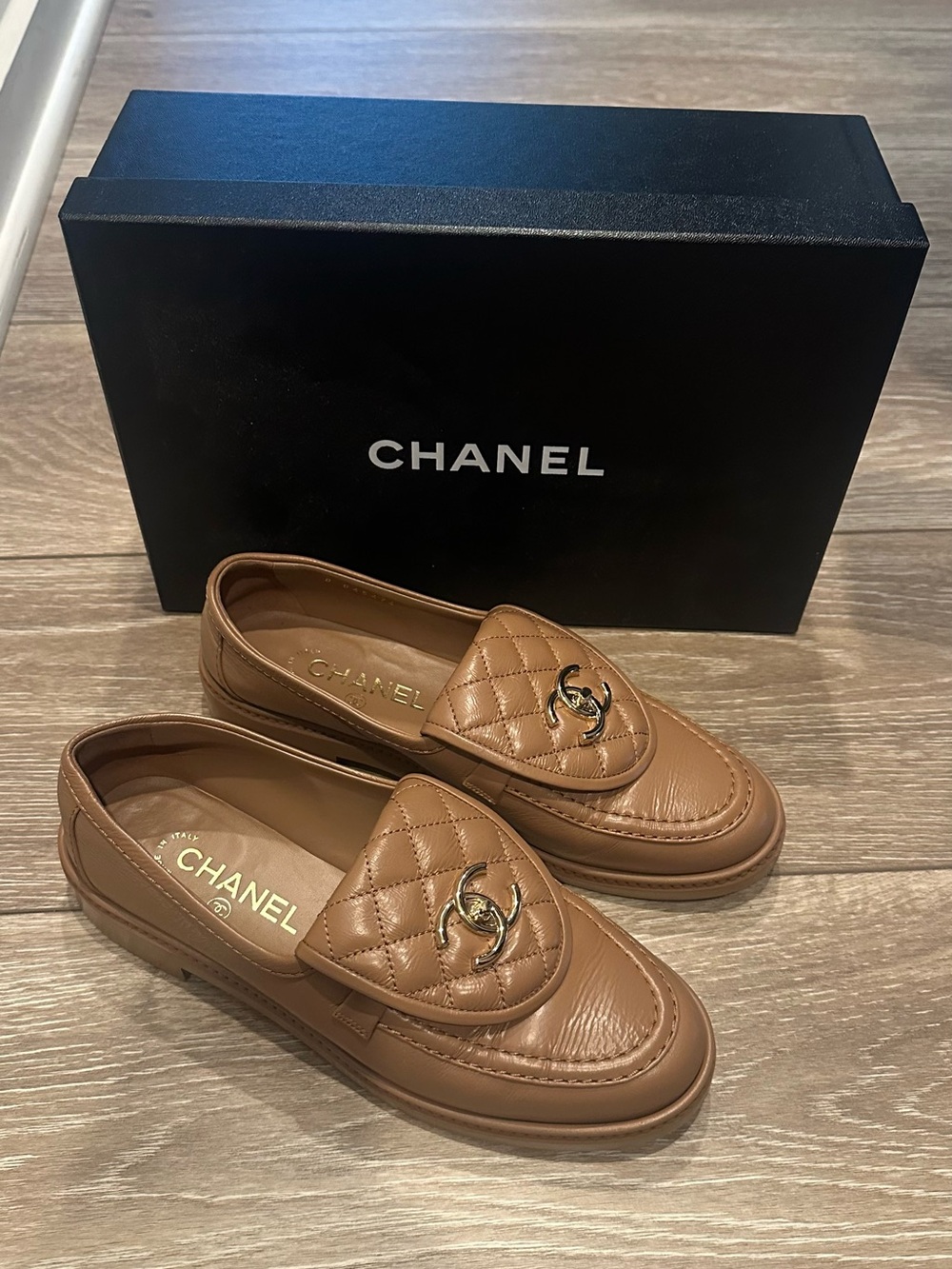 CHANEL Quilted CC Logo Leather Loafers in Tan Brown